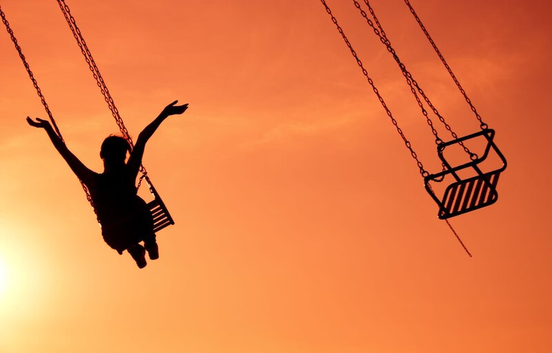 Silhouette of Child on Swing — Orange