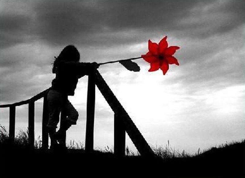 Silhouette of Child with Flower