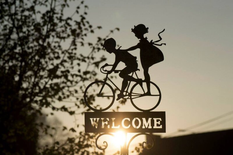 Silhouette of children on bicycle