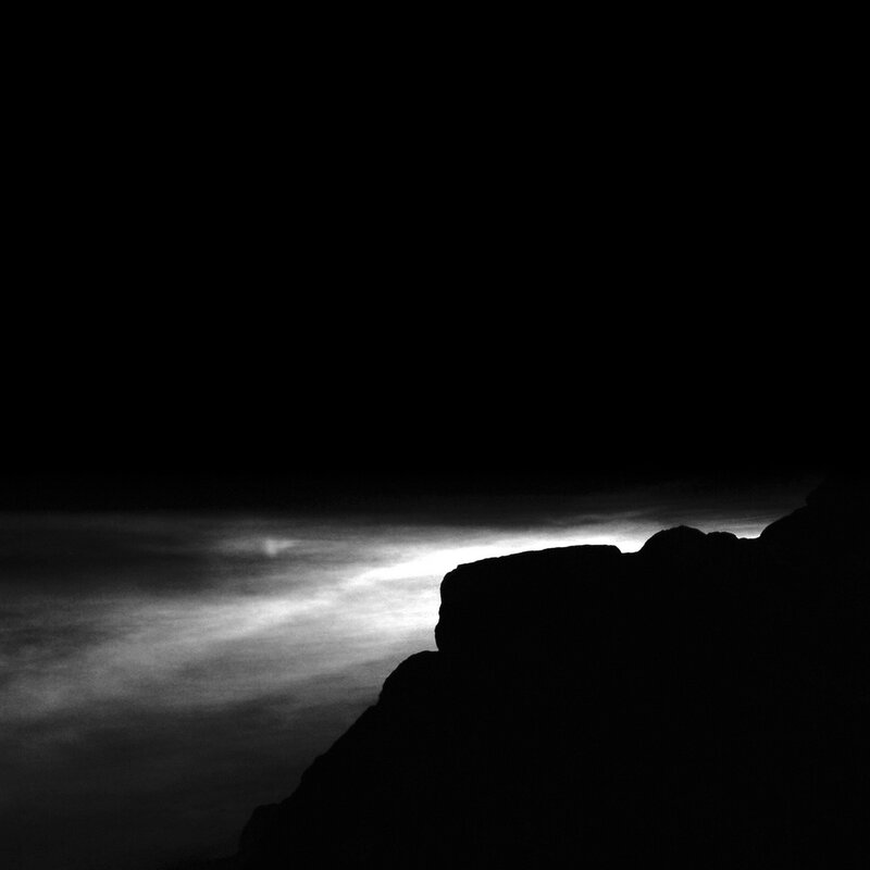 silhouette of cliff at night
