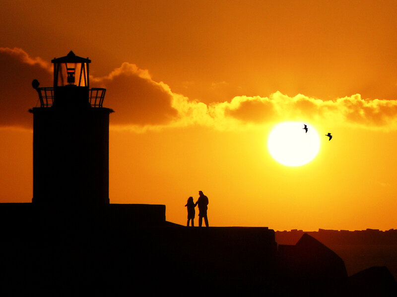 Silhouette of Couple at Lighthouse