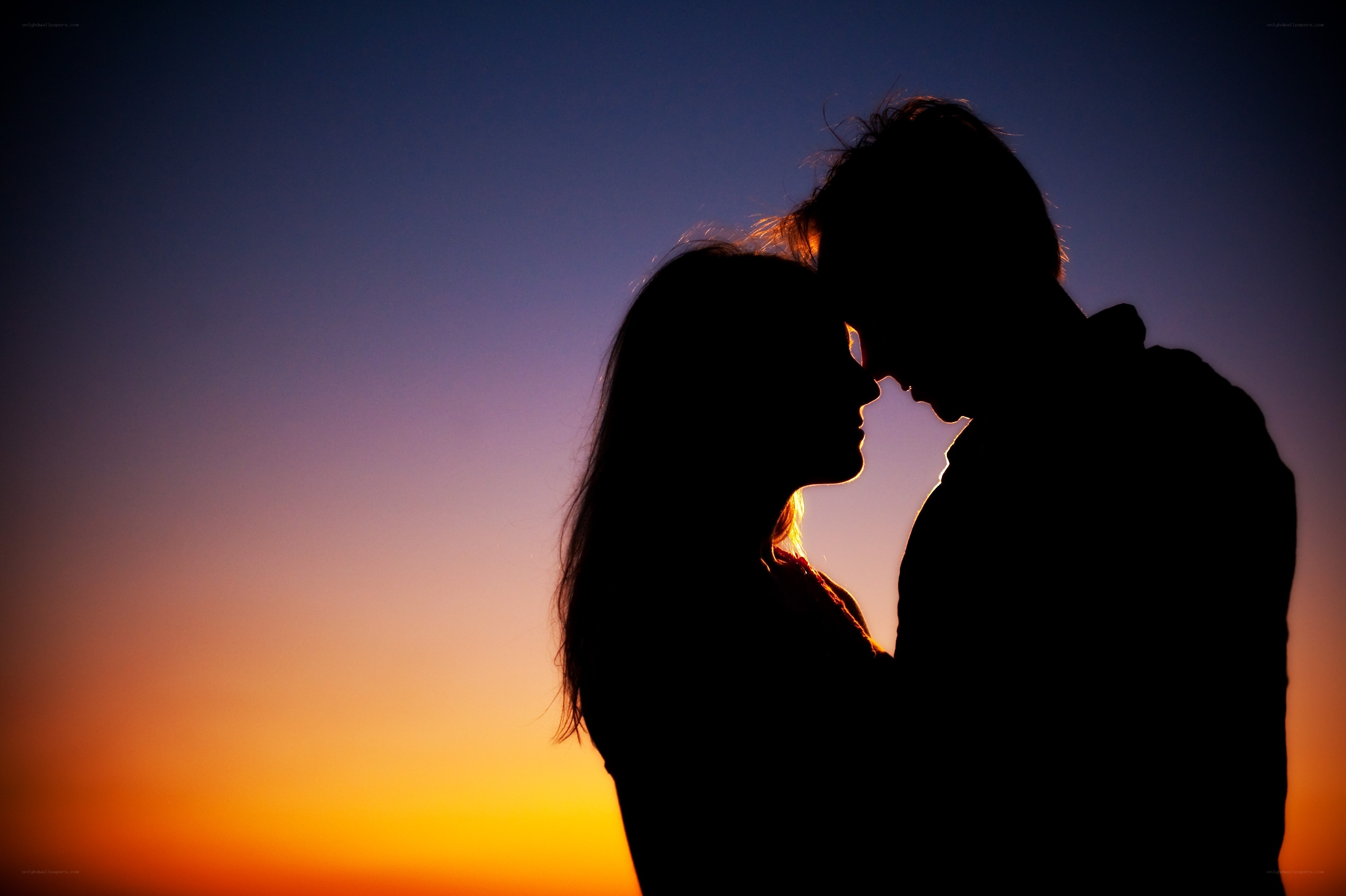 silhouette of couple at sunset