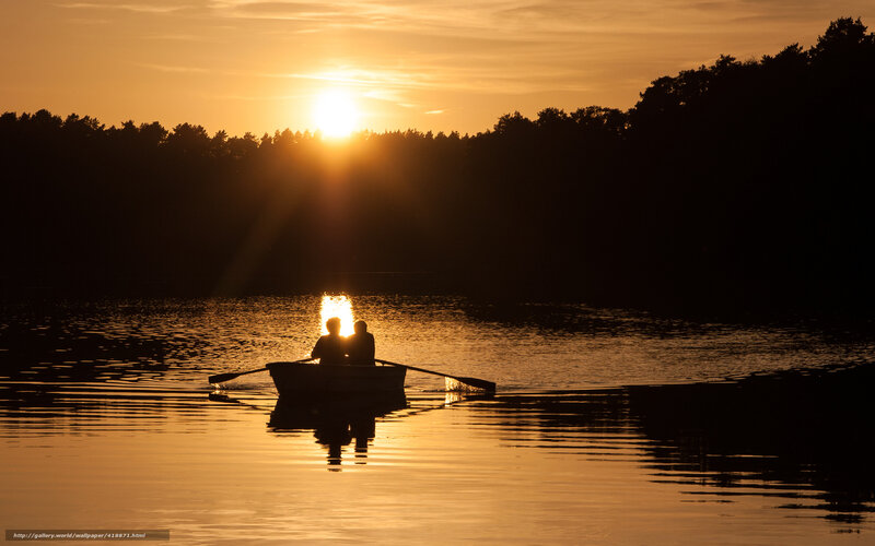 Silhouette of couple in rowboat