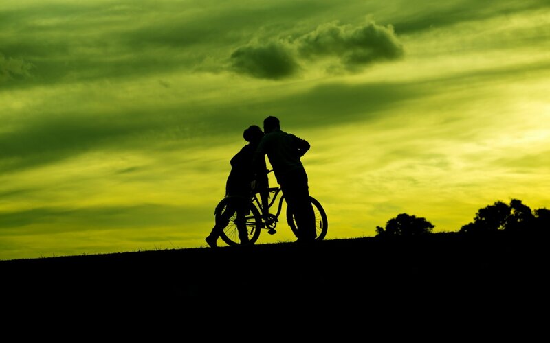 Silhouette of Couple with Bicycle