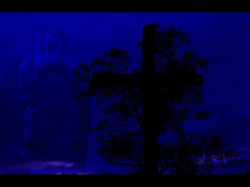 Silhouette of cross and angel