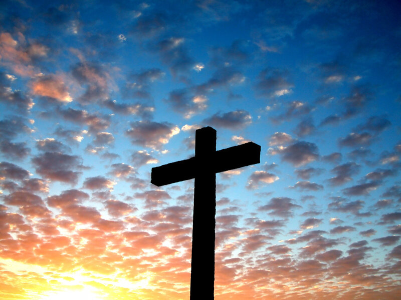 silhouette of cross at sunset
