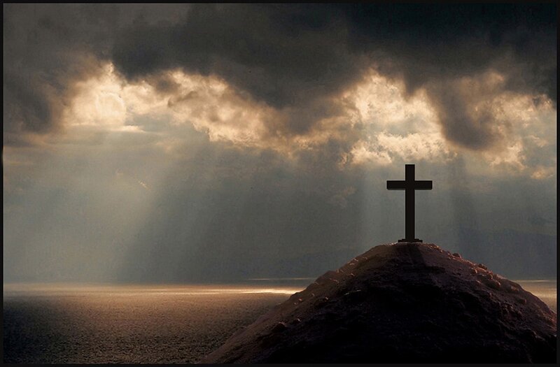 Silhouette of Cross on Hill