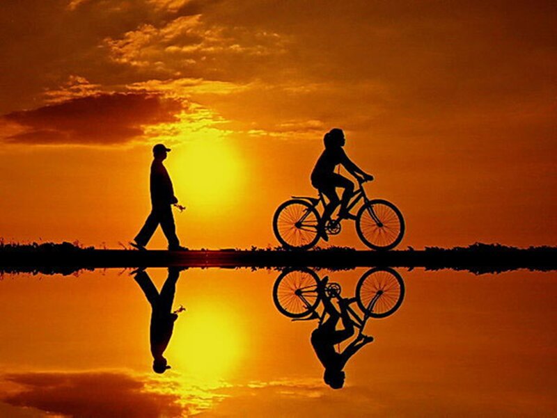 Silhouette of Cyclist and Walker