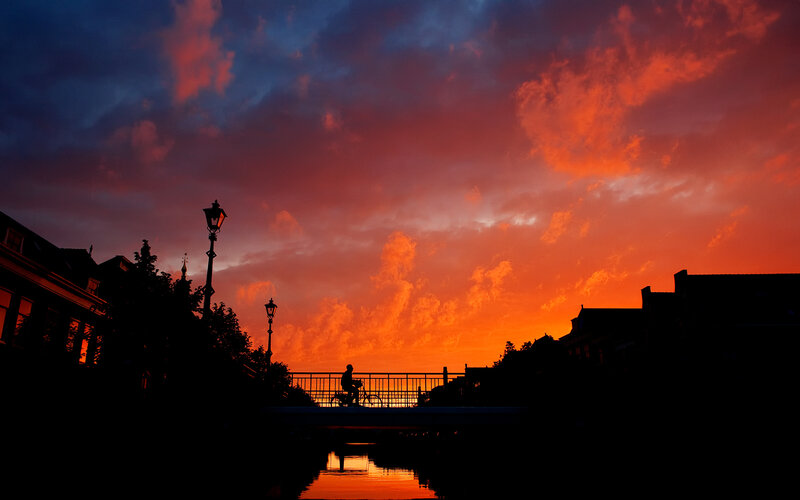 Silhouette of cyclist at sunset