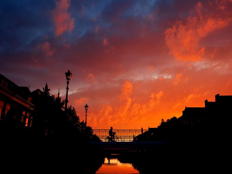 Silhouette of cyclist at sunset