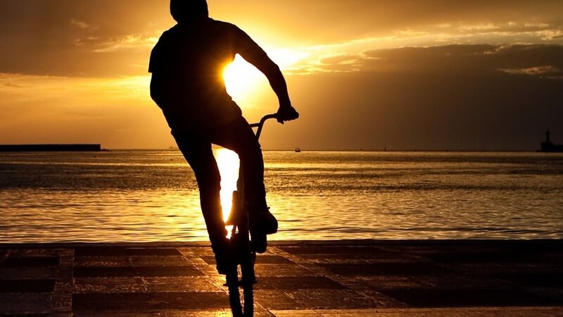 Silhouette of cyclist at sunset