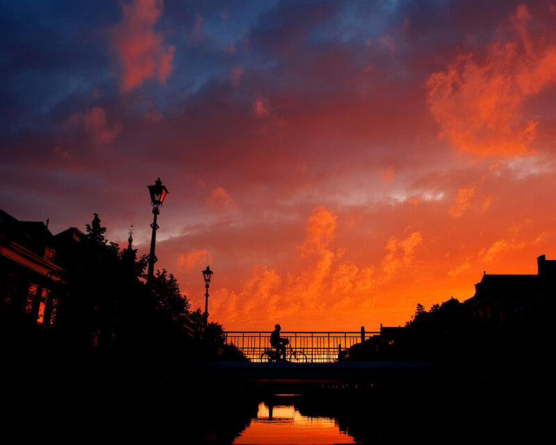 Silhouette of cyclist at sunset
