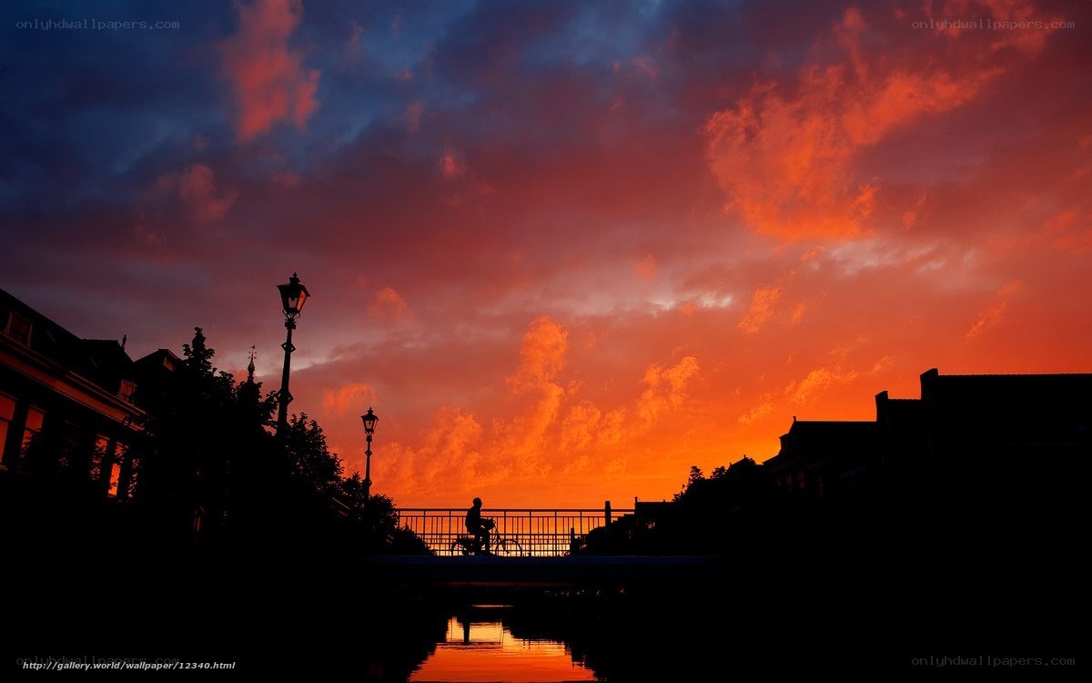 Silhouette of cyclist at sunset