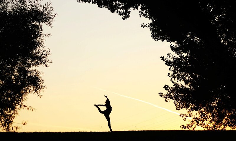 Silhouette of dancer at sunset