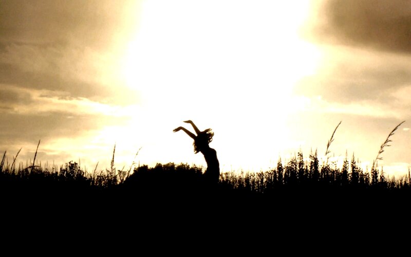 Silhouette of dancer at sunset
