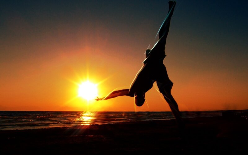 Silhouette of dancer at sunset