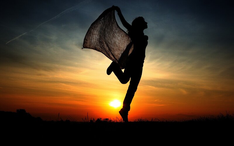 Silhouette of dancer at sunset