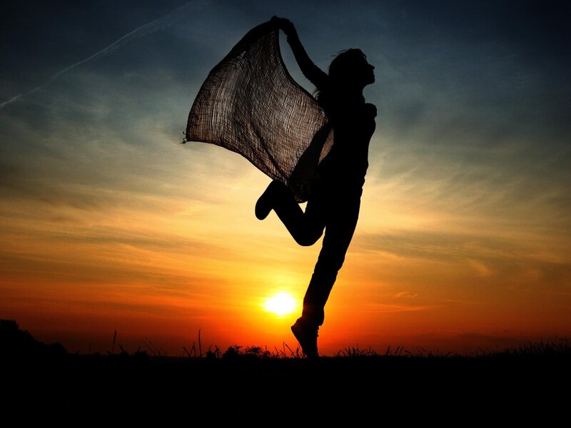 Silhouette of dancer at sunset