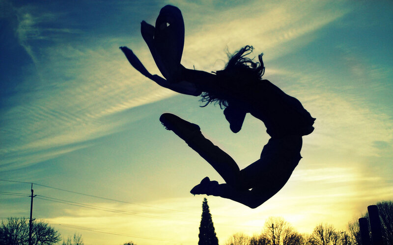 silhouette of dancer jumping