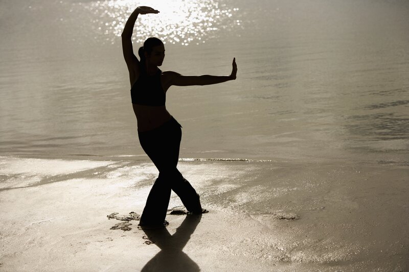Silhouette of dancer on beach
