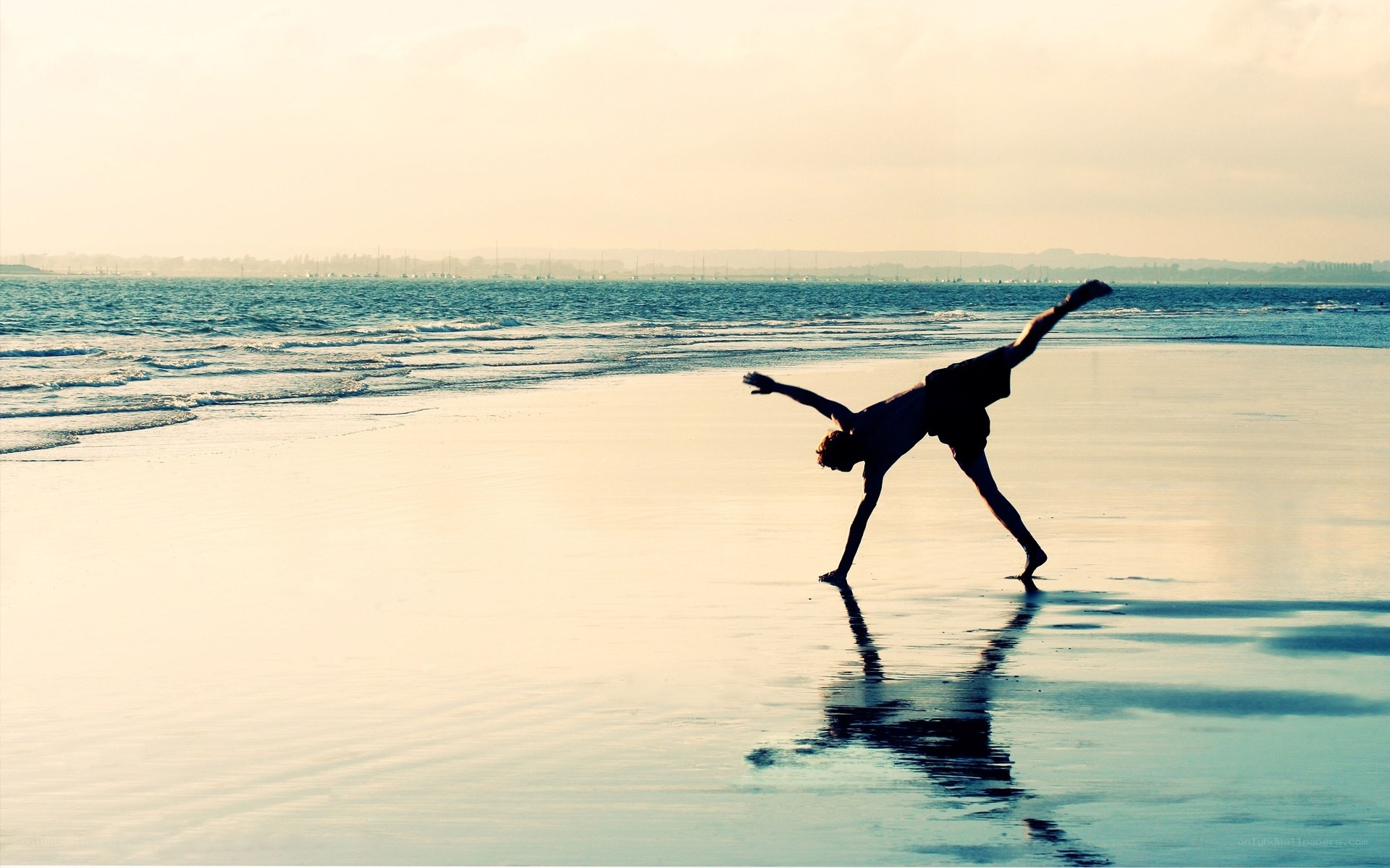 Silhouette of dancer on beach