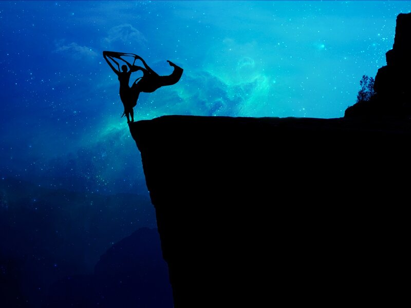 Silhouette of Dancer on Cliff