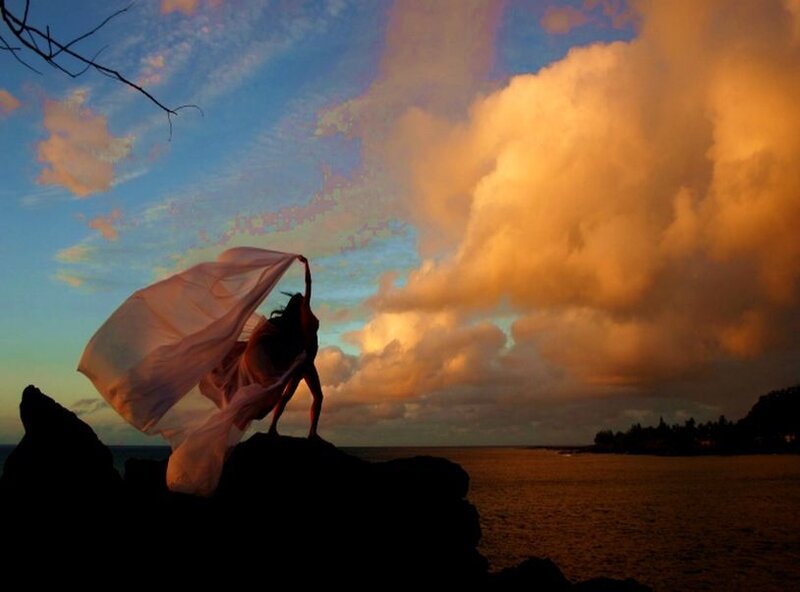 Silhouette of Dancer on Rock