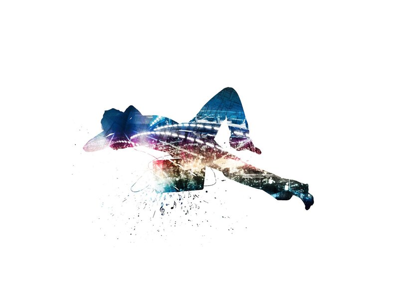 silhouette of dancer with city lights
