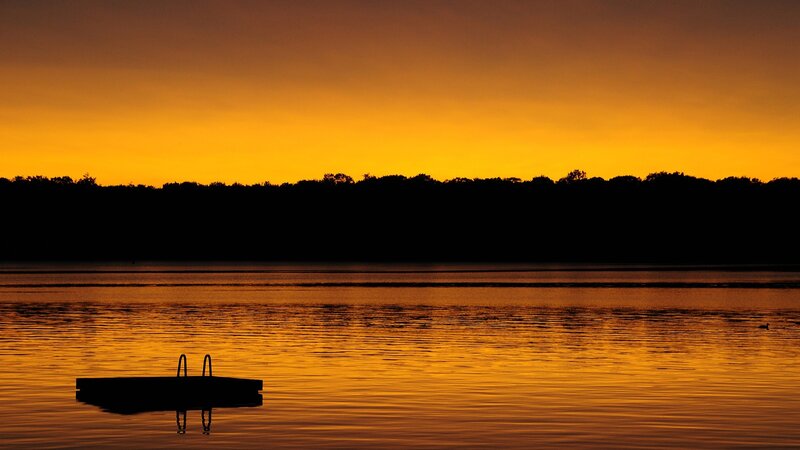 Silhouette of Dock on Lake — Orange