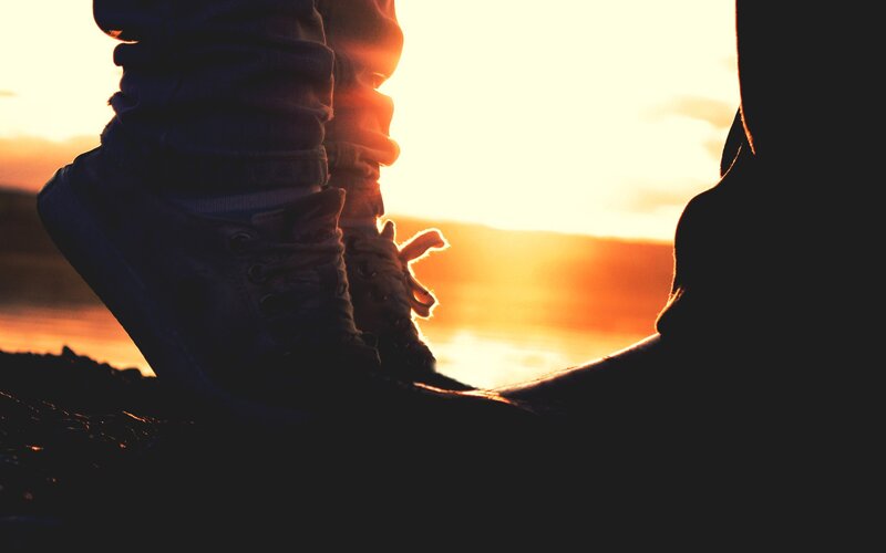 silhouette of feet at sunset