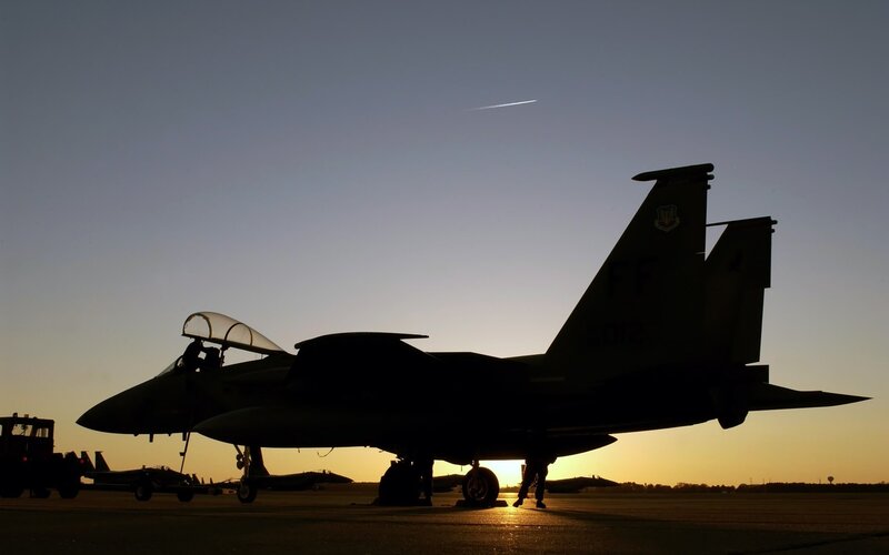 Silhouette of Fighter Jet — Black, Dramatic, Sunrise