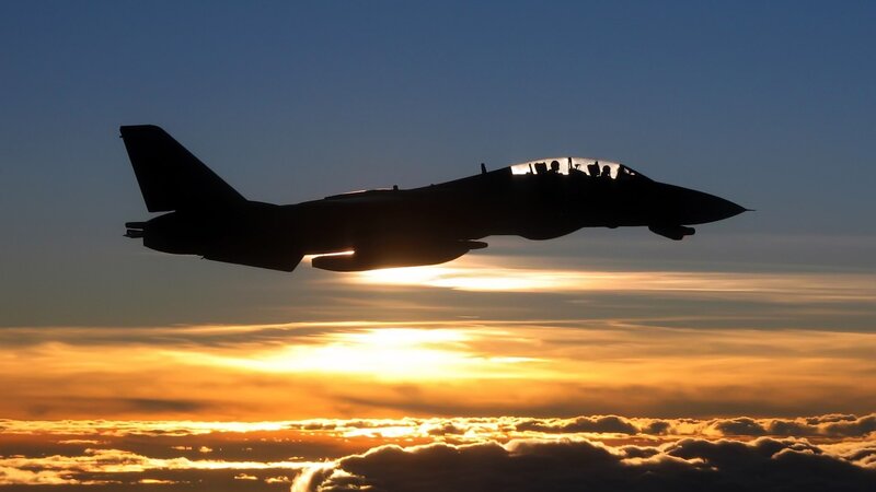 Silhouette of Fighter Jet — Blue, Dramatic, Sunset, Photograph, Sky, Clouds, Sun, Orange, Yellow