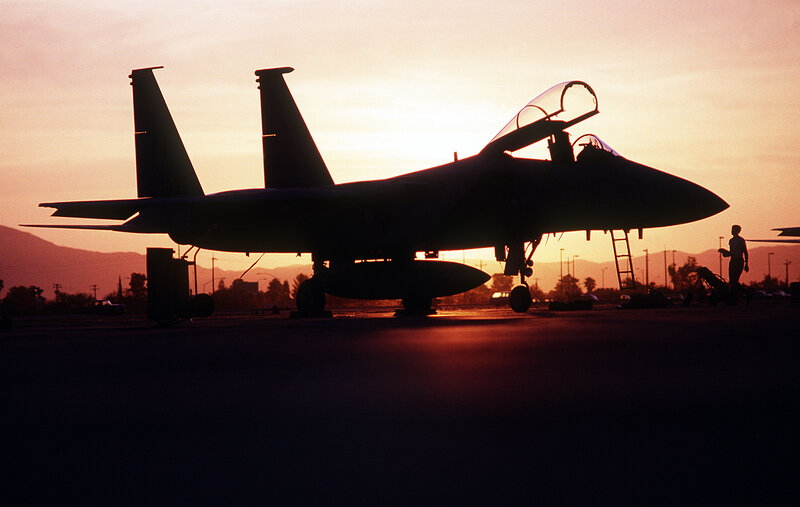 Silhouette of Fighter Jet — Orange, Dramatic, Sunset, Photograph, Person