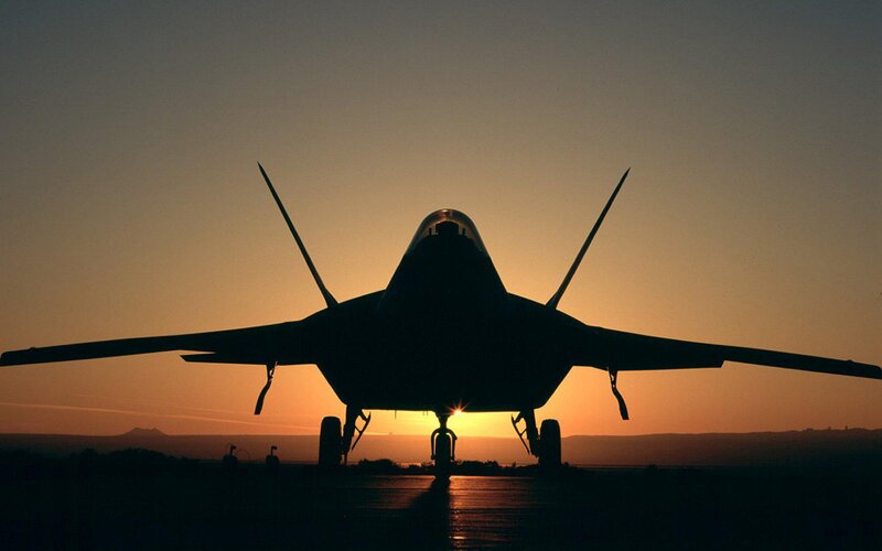 Silhouette of Fighter Jet — Orange, Dramatic, Sunset, Photograph, Runway, Mountains