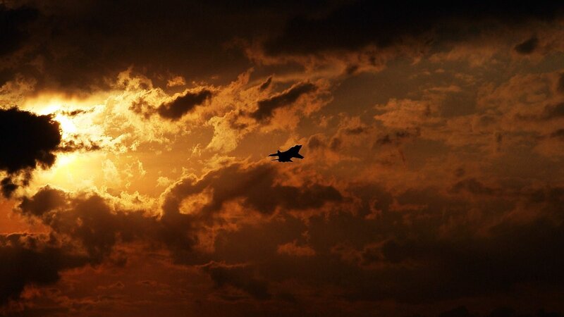 Silhouette of Fighter Jet — Orange, Dramatic, Sunset