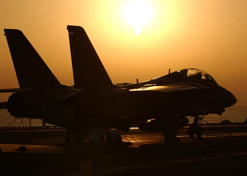 Silhouette of fighter jets at sunset