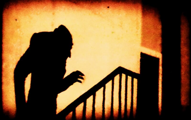 silhouette of figure on stairs