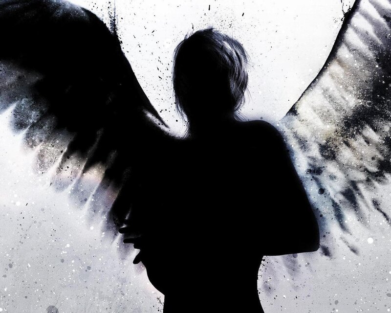 Silhouette of Figure with Wings