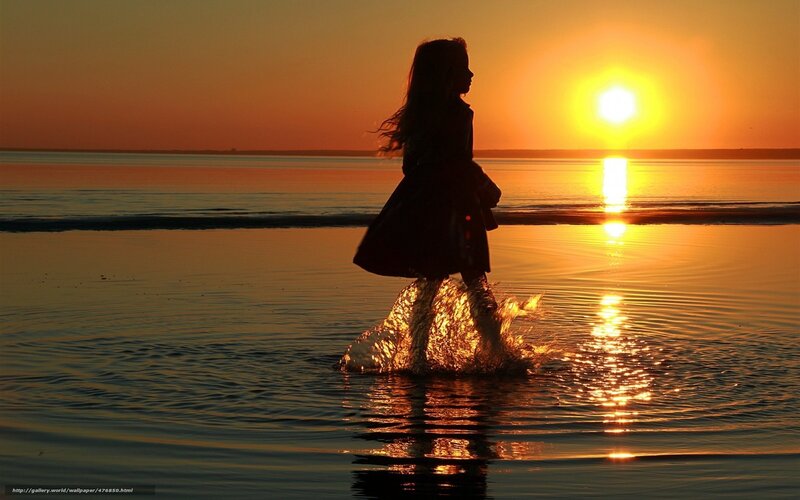 Silhouette of girl at sunset