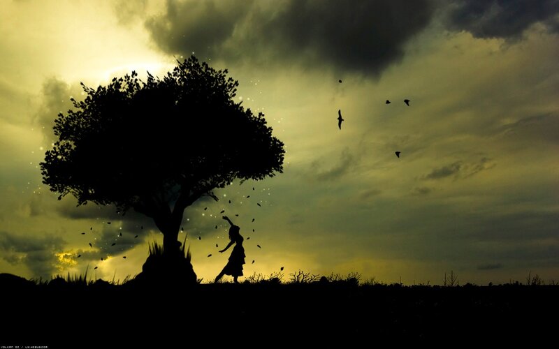 Silhouette of girl under tree