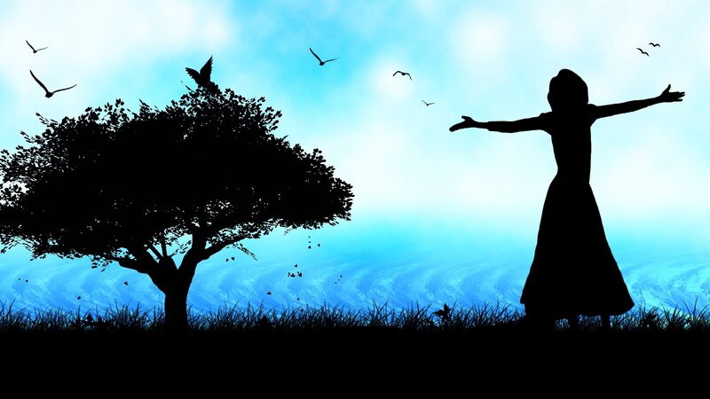 silhouette of girl with arms outstretched