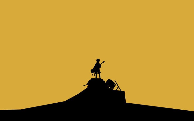 silhouette of guitarist on hill