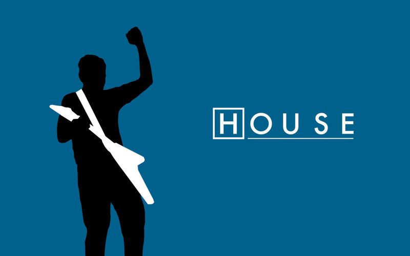 silhouette of guitarist with raised fist