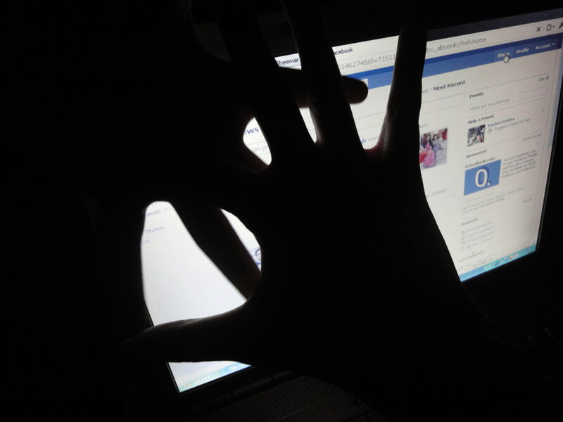 Silhouette of Hand on Laptop