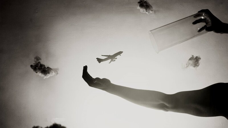 Silhouette of Hands and Airplane