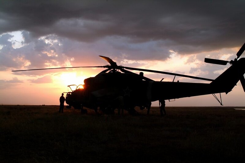 Silhouette of helicopter at sunset