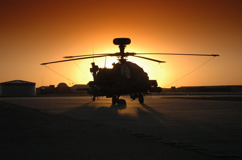 silhouette of helicopter at sunset
