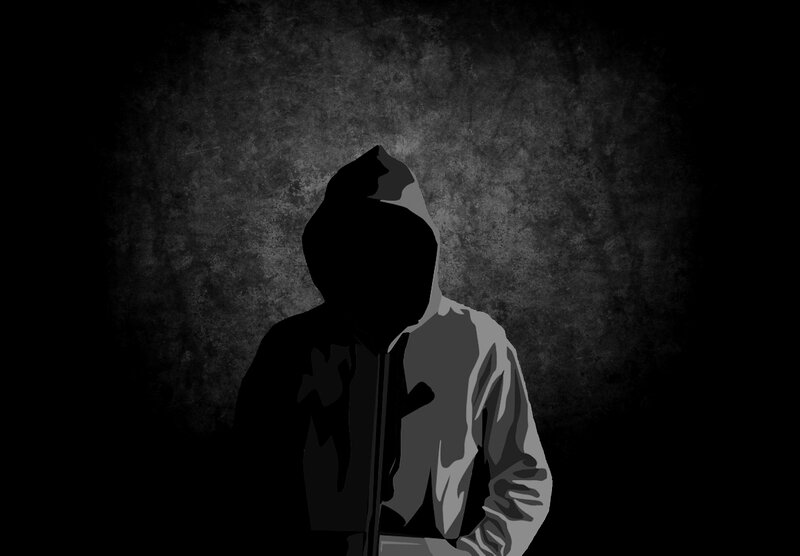 silhouette of hooded figure