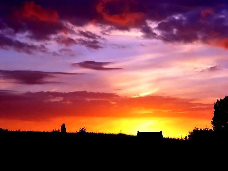 Silhouette of House at Sunset