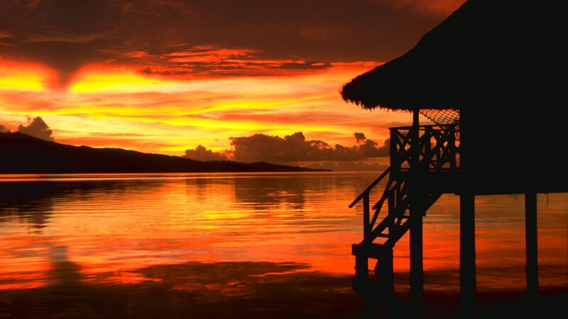 Silhouette of Hut at Sunset